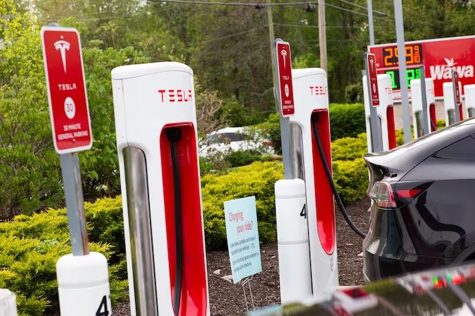 Elon Musk Agrees to Open Parts of Tesla’s Charging Network to Everyone
