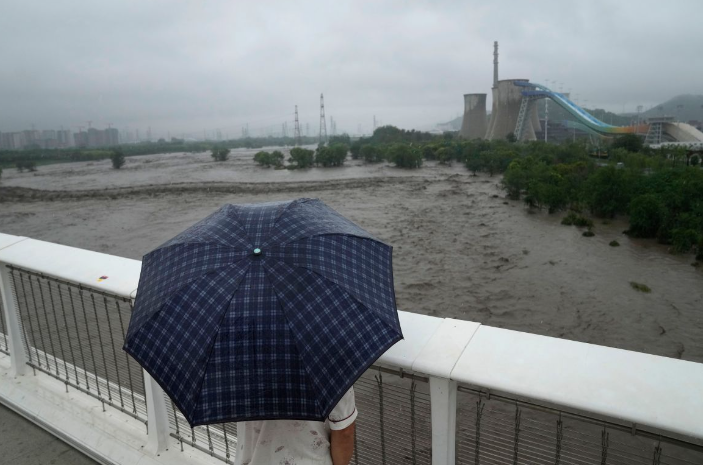 Photos: Extreme rain in Beijing after typhoon turns roads into rivers