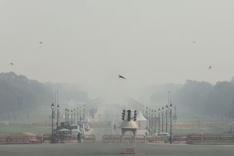 People walk on 'Kartavya Path' amidst the morning smog as air pollution levels declined in New Delhi, India, November 6, 2023.REUTERS/Anushree Fadnavis